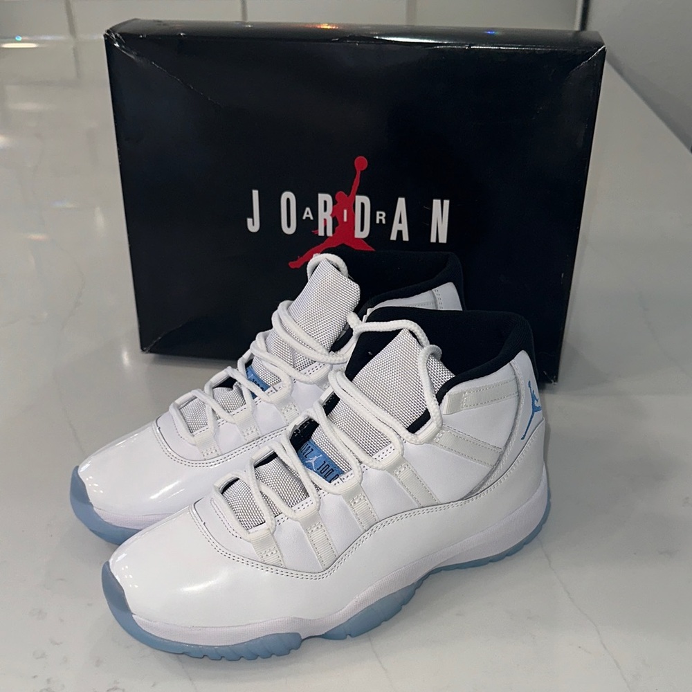 Air Jordan 11 Retro. White and Light Blue Athletic Shoes